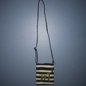 striped purse with gold M .